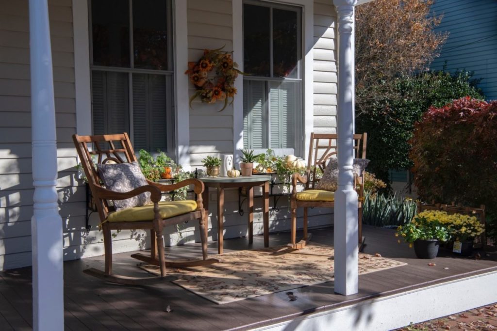 Decorated front porch to improve home's curb appeal. 